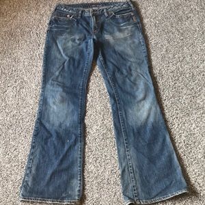 Distressed silver jeans